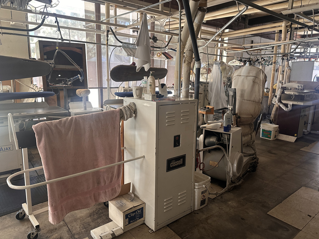 Dry cleaner presses and spotting tables auction